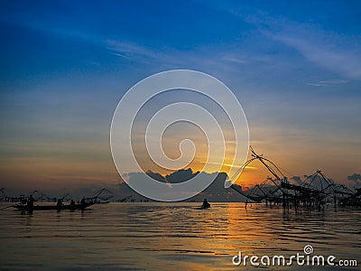 Silhouette thai traditional fishing equipment trap build with ba Stock Photo